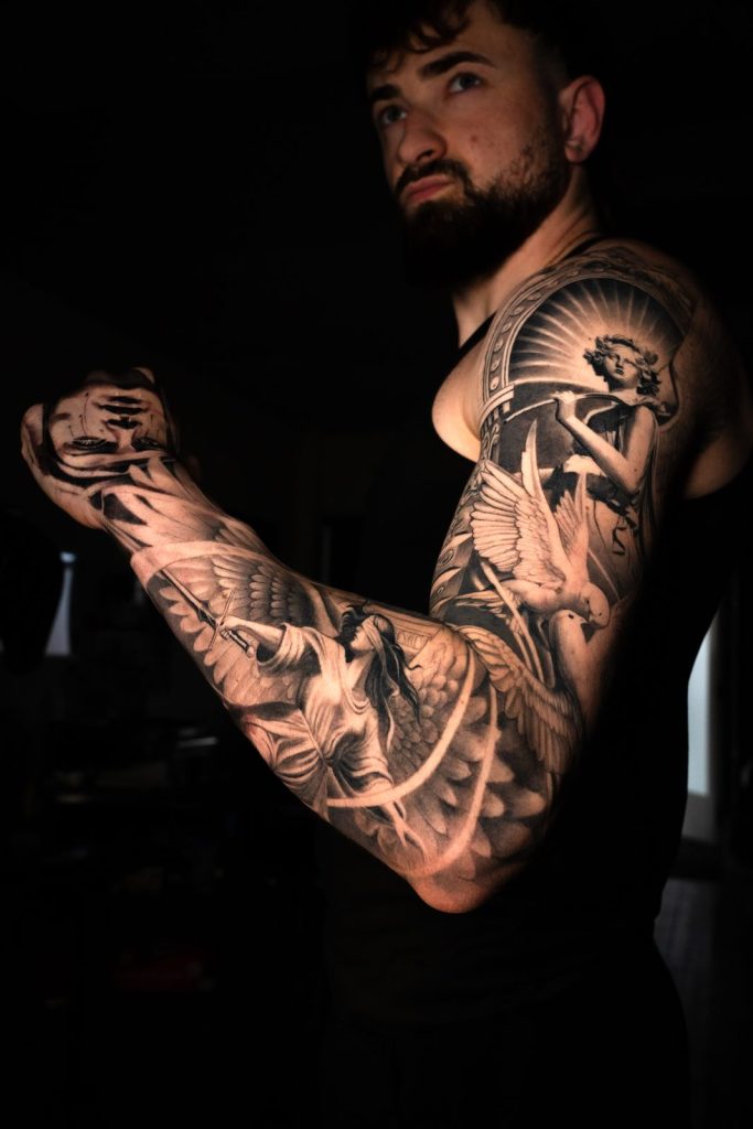 Black grey realism sleeve portrait tattoo by The KCHN Tattoos, Scarborough