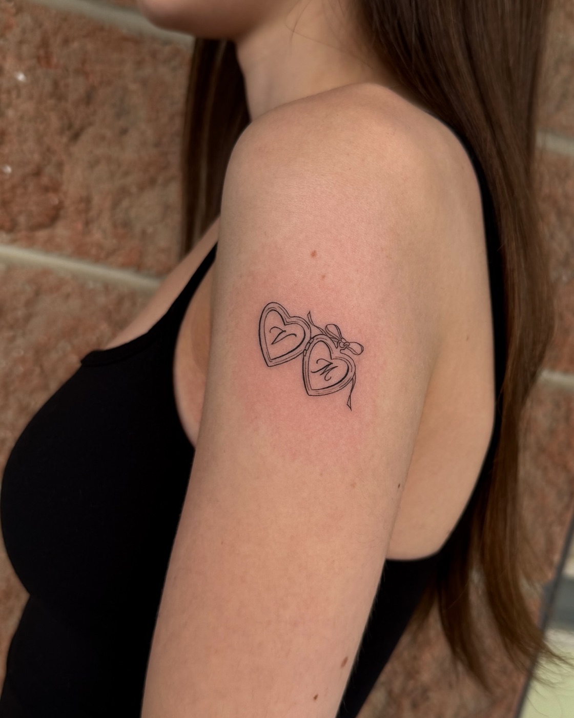 Heart lockets by a fine line tattoo artist Agincourt clients visit at The KCHN Tattoos