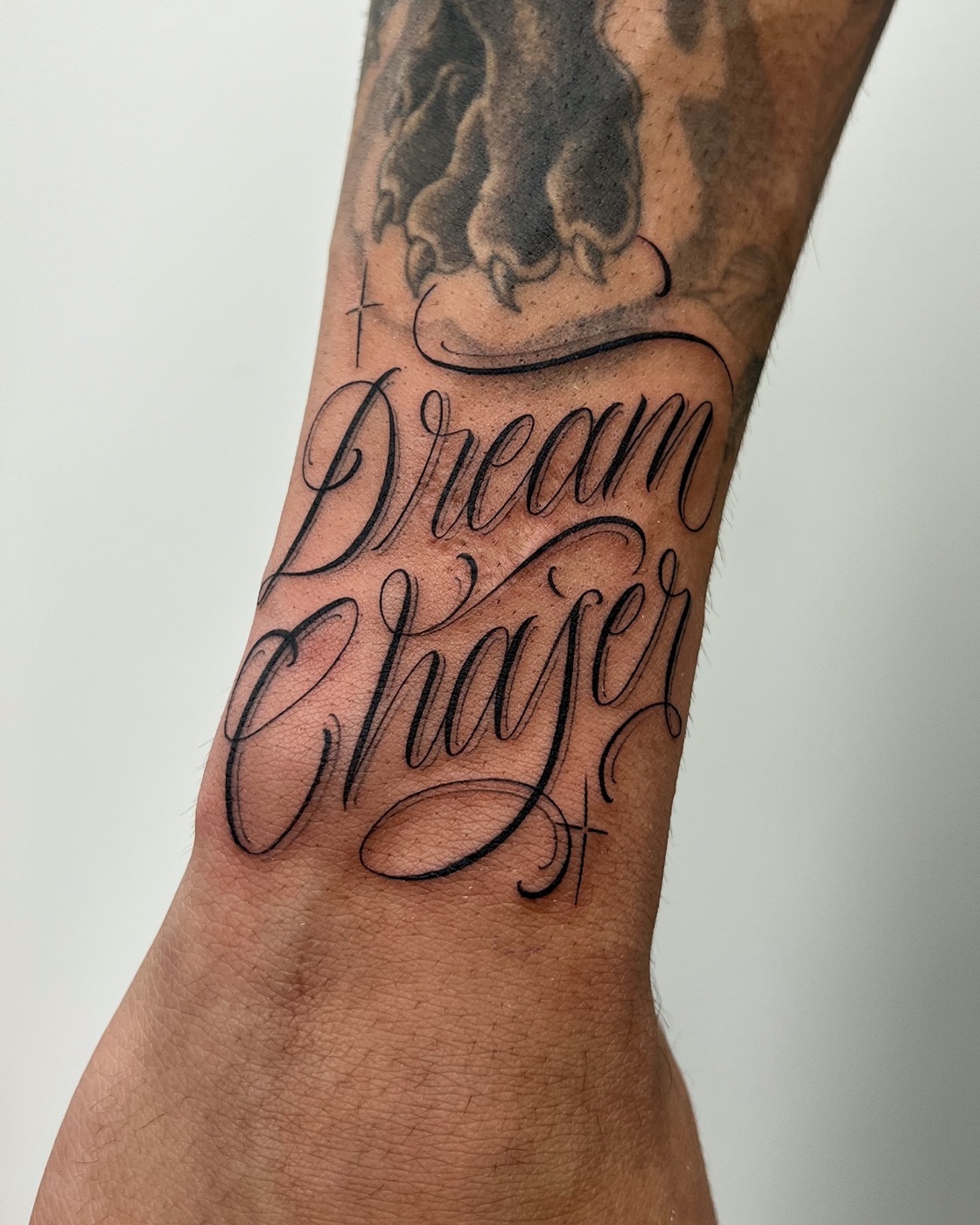 Dream chaser lettering, a common pick for Pickering walk in tattoos at The KCHN Tattoos