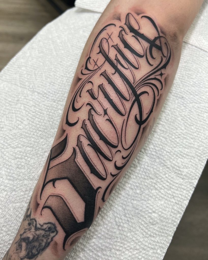 Lettering ornate script tattoo by The KCHN Tattoos, Scarborough