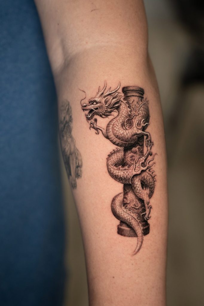 Black and grey realism dragon calf tattoo by The KCHN Tattoos, Scarborough