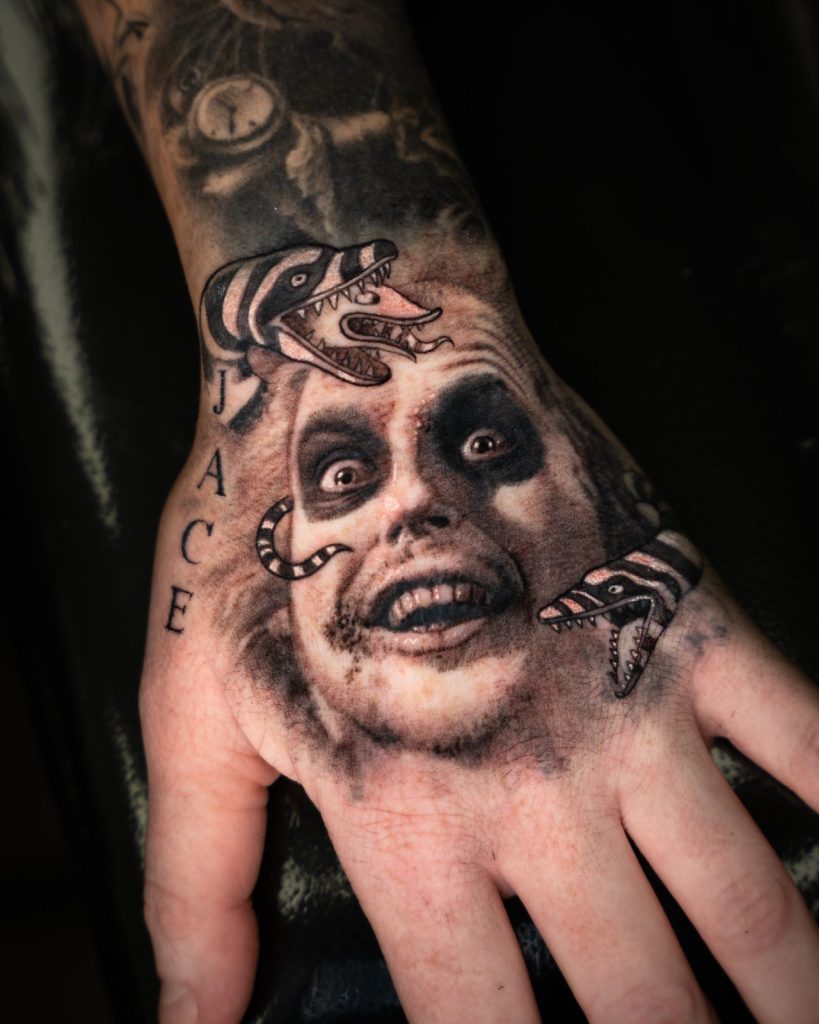 Black and grey realism hand tattoo portrait tattoo by The KCHN Tattoos, Scarborough