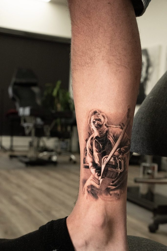 Black and grey realism lower leg tattoo by The KCHN Tattoos, Scarborough